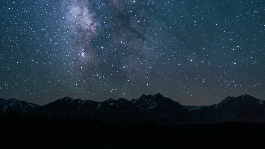Fantastic moonrise above mountains and the starry night sky