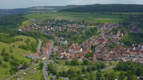 Aerial view of the village Urphar in Germany. Very wide view of the whole town with pan to the right.