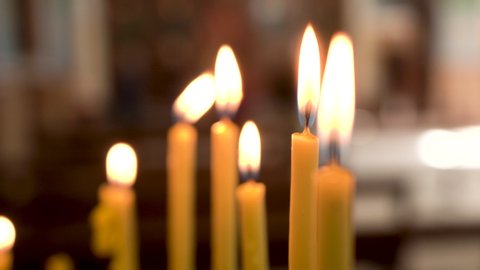 Madaba / Jordan - 01 11 2019: Madaba, Jordan, January 2019 - A Pack of Burning Candles With Some Blurred Background in Madaba St George's Greek Orthodox Church