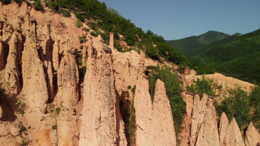 Natural wonder, rock formation - Devil's Town -Djavolja Varos- Serbia. A peculiar rock formation, located in south Serbia, created by strong erosion of the soil. Royalty-Free Stock Footage #1035670481