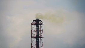 Video of industrial chemical factory with smoke from pipes