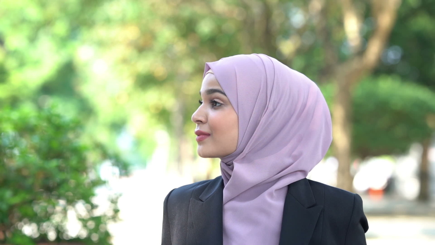 Beautiful Muslim business woman smiling.