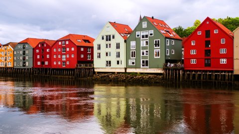 Trondheim, Norway. City center of Trondheim, Norway during the cloudy summer day. Time-lapse of historical colorful building and grey cloudy sky, panning video