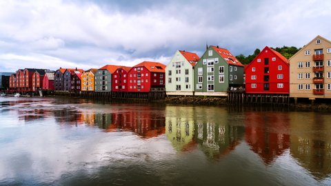 Trondheim, Norway. City center of Trondheim, Norway during the cloudy summer day. Time-lapse of historical colorful building and grey cloudy sky, zoom in