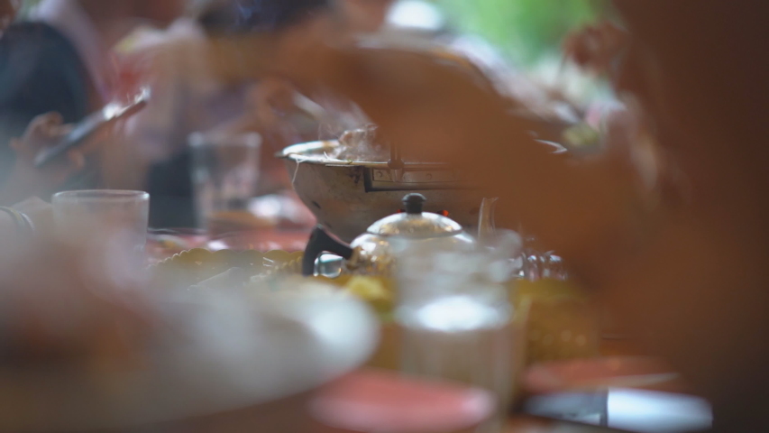 Slow motion pork meat grilled on pan for eating food of people in restaurant 