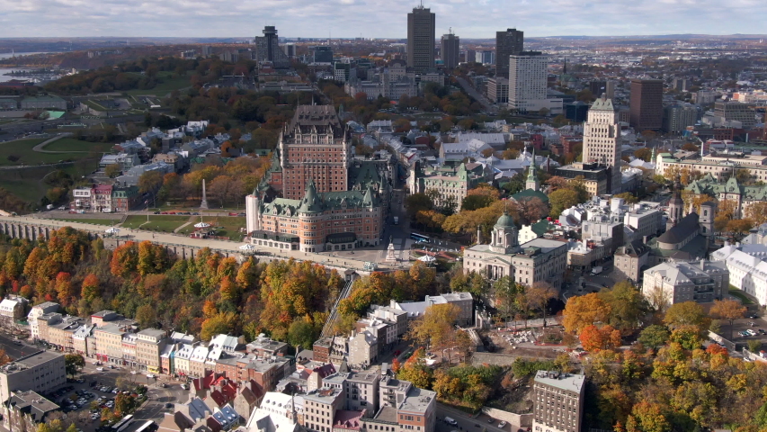 Aerial view of Quebec City showing architectural landmark Frontenac castle and maple trees changing colour during Fall season in Quebec, Canada.