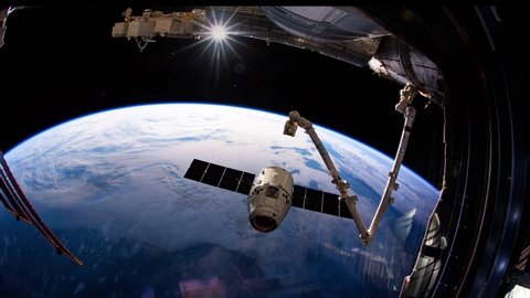 International Space Station - Circa May 2019: SpaceX Dragon spacecraft is approaching to the International Space Station. Elements of this video furnished by NASA. ISS 059
