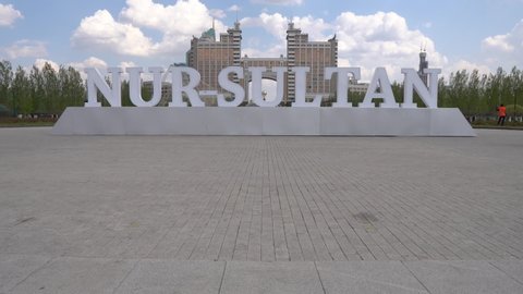 Nur-Sultan Astana Light Blue Colored Welcome Billboard at Lover's Park on a Sunny Cloudy Blue Sky Day