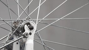 Close-up of male hands in gloves remove the front wheel of a bicycle from a fork. - Powered by Shutterstock - Get 15% off with code: PIKWIZARD15
