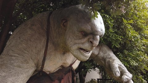 Wellington / New Zealand - 05 24 2019: Cave troll statue standing guard outside Weta Workshop movie production and special effects house in Wellington New Zealand.
