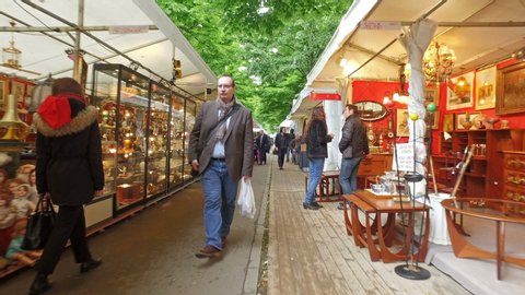 PARIS, FRANCE, circa MAY, 2019: Shops at Saint-Ouen Flea Market, also known as Porte de Clignancourt. Tourist POV, cinematic steadicam shot