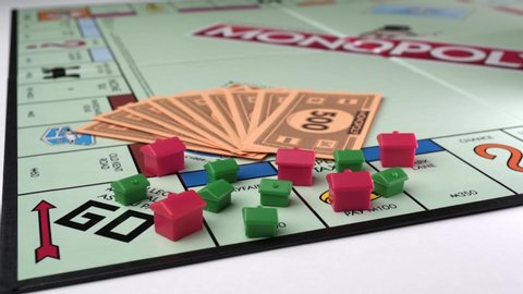 LONDON , London / United Kingdom (UK) - 06 17 2019: Monopoly board game with houses and money