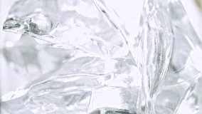Cola with ice. Pouring Cola with Ice and bubbles in a glass. Slow motion 240 fps. Close up food and beverage background. Stock full HD video footage 1920x1080p. 