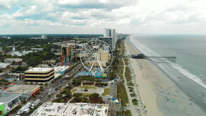 Wide aerial parallax shot of skywheel in Myrtle Beach, South Carolina.