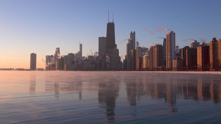Early morning of Chicago skyline with sea smoke on Lake Michigan during polar vortex timelapse 4k
