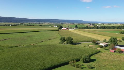 BELLEVILLE, PENNSYLVANIA - 11 AUG 2019: Aerial Pennsylvania farms Amish Kishacoquillas Big Valley . Settled 1791. Third oldest Amish Mennonite settlement in existence. Rural old order.