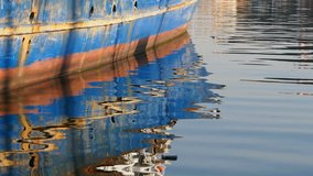 Boat and Reflections On The Sea
