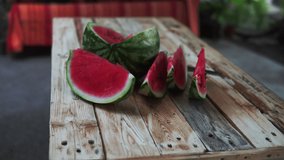 Summer ripe sliced watermelon. Juicy slice of ripe watermelon, close-up. Concept summer ripe berry on a wooden board.