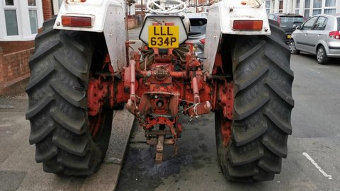 Reading, Berkshire, United Kingdom (UK) - 06 12 2019: Old white tractor found on the road