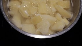 close up chopped potatoes are boiled in a pan on an electric stove.boiled potatoes in a pan. 4k. 4k video