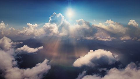 Flying through heavenly beautiful sunny cloudscape. Amazing timelapse of golden fluffy clouds moving softly on the sky and the sun shining above the clouds with beautiful rays and lens flare.