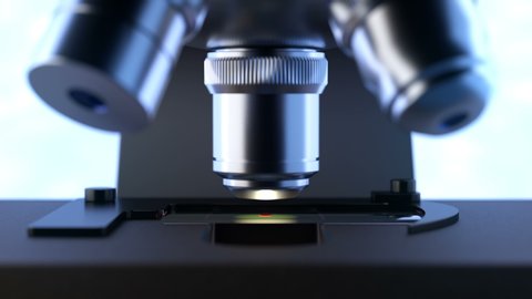 Close-up shot of automated scientific laboratory microscope examining a drop of blood on a prepared sample slide. Seamless loopable animation can be used in education, science or medicine industry