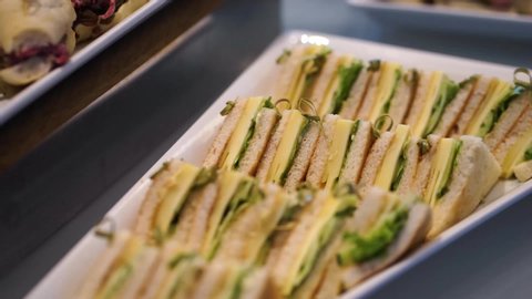 Small sandwiches, tapas, snacks on the table. Catering and buffet. Meals, food and desserts for guests at the hotel, at the event.