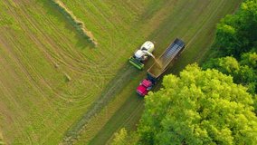 Farm Machine and semi truck harvesting crop from field quickly and efficiently.
