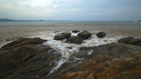 4k video of sea wave with stone at Khao Laem Ya in Mu Ko Samet National Park, Rayong Province, Thailand