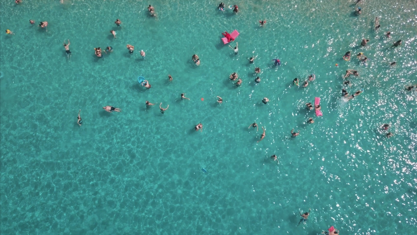 Aerial top view of people swimming beautiful turquoise  sandy beach - crowded beach - Incekum Beach - Marmaris Turkey | Shutterstock HD Video #1035847055