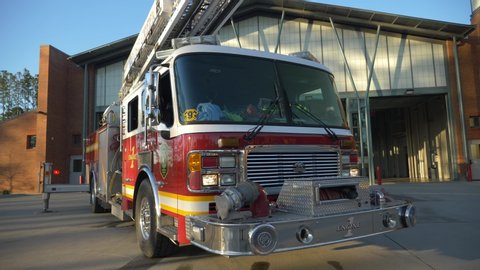 Goose Creek , South Carolina / United States - 02 16 2018: Fire engine sits shiny outside of a fire station in the early morning sunlight