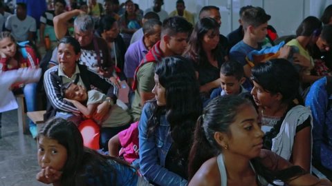 Pacaraima / Brazil - 05 27 2019: Incoming Venezuelan asylum seekers wait to enter a refugee camp