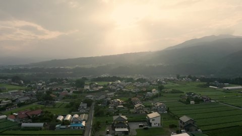 4k aerial drone footage - The beautiful mountainous countryside of Japan.  The many rice fields, mountains, and villages of Gunma Prefecture.