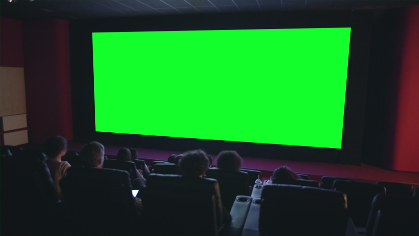 Slow motion of happy viewers crowd clapping hands looking at green chroma key cinema screen expressing admiration. Business, movie theater and emotions concept. | Shutterstock HD Video #1035866465