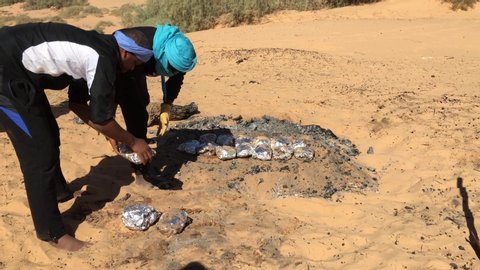 Beni Abbes, Bechar, Algeria - November 02, 2017: Cooking chicken meat in traditional way in Algerian Sahara.