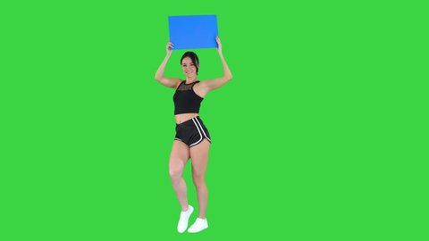 Ring girl walking holding empty board presenting new round on a Green Screen, Blue mockup.