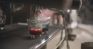 Close-up of pink and blue matcha coffee in coffee machine. 4K Slow Motion Video
