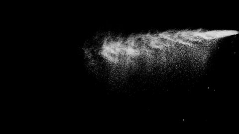 Long spray of particles spurt from side falling, shot in studio filling frame