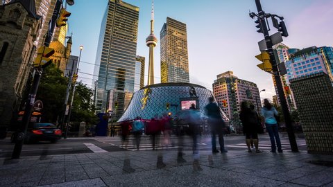 Toronto, Canada - September 14, 2016 : Roy Thomson Hall in front of CN tower in Toronto downtown time lapse