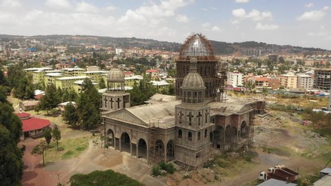 Rotating drone shot of spectacular Christian Orthodox cathedral under construction in Addis Ababa, religion and architecture in Ethiopia Africa
