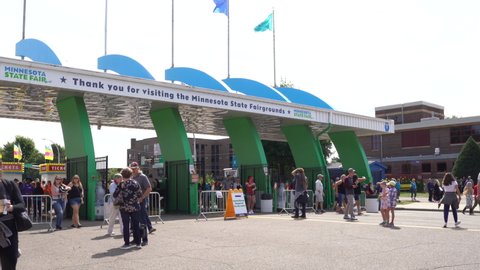 Falcon Heights, MN - August 25, 2019: Entrance gates to the Minnesota State Fair. Crowds of people arrive at the iconic midwest festival