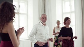 Group of senior people in dancing class with dance teacher. - Powered by Shutterstock - Get 15% off with code: PIKWIZARD15