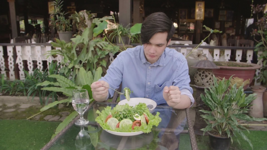 Man Eating Fresh Salad, Slow Motion
