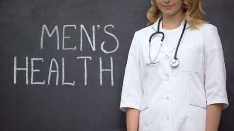 Urologist standing near Mens health words, medical exam to prevent prostatitis