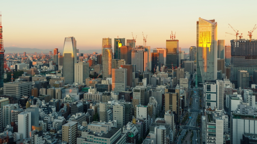 Time Lapse of the densely packs buildings of Tokyo Japan at sunrise