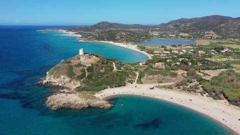 View from flying drone. Astonishing summer view of popular tourist destination, Acropoli di Bithia with Torre di Chia tower on background. Aerial morning view of Sardinia island, Italy, Europe.