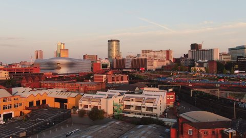 birmingham aerial view drone at sunrise rising up over city downtown reveal shot uk england