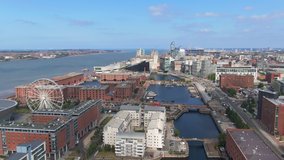 liverpool aerial view fly forward over albert dock sunny day uk england