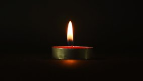 Candlelight in black background, HD Video