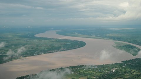 Aerial view of beautiful river, clouds and land. Mekong river, Cambodia